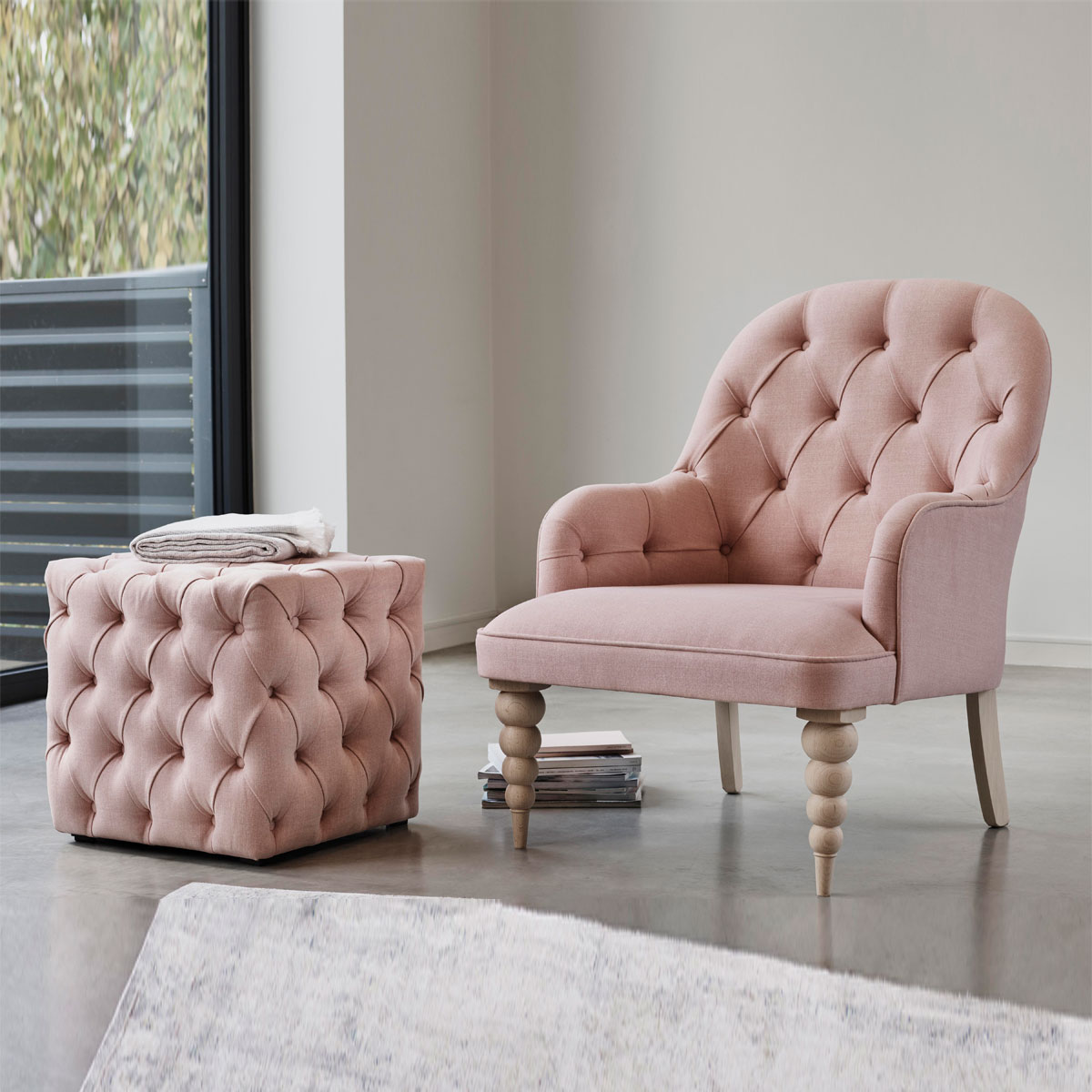 Pink tufted store chair